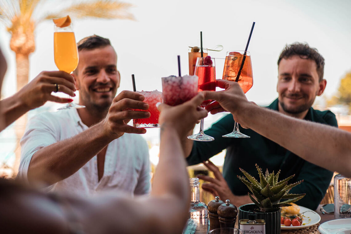 Group enjoying drinks at happy hour in Palmanova