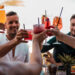 Group enjoying drinks at happy hour in Palmanova